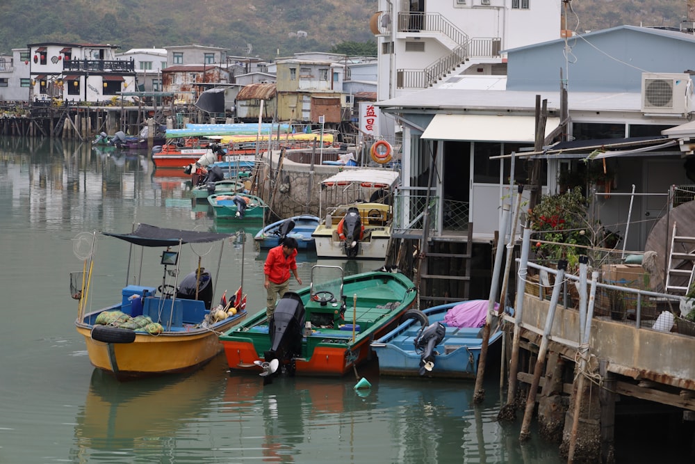 a group of boats floating on top of a river