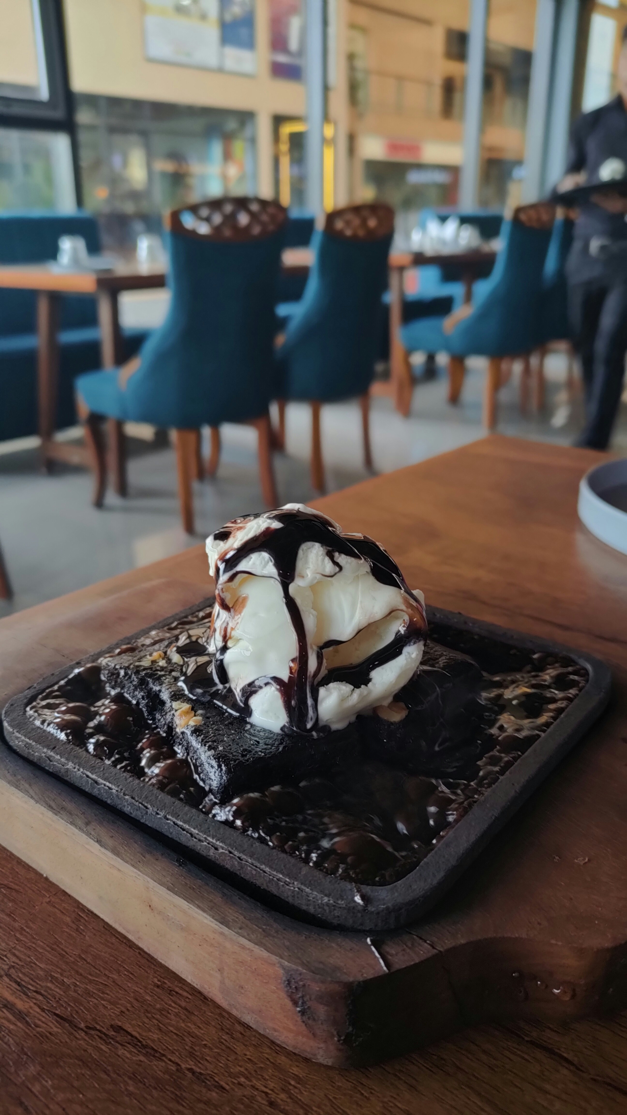 Sizzling Brownie — Hot brownie served sizzling with ice cream, Indian café food photography with warm colours and appetising presentation