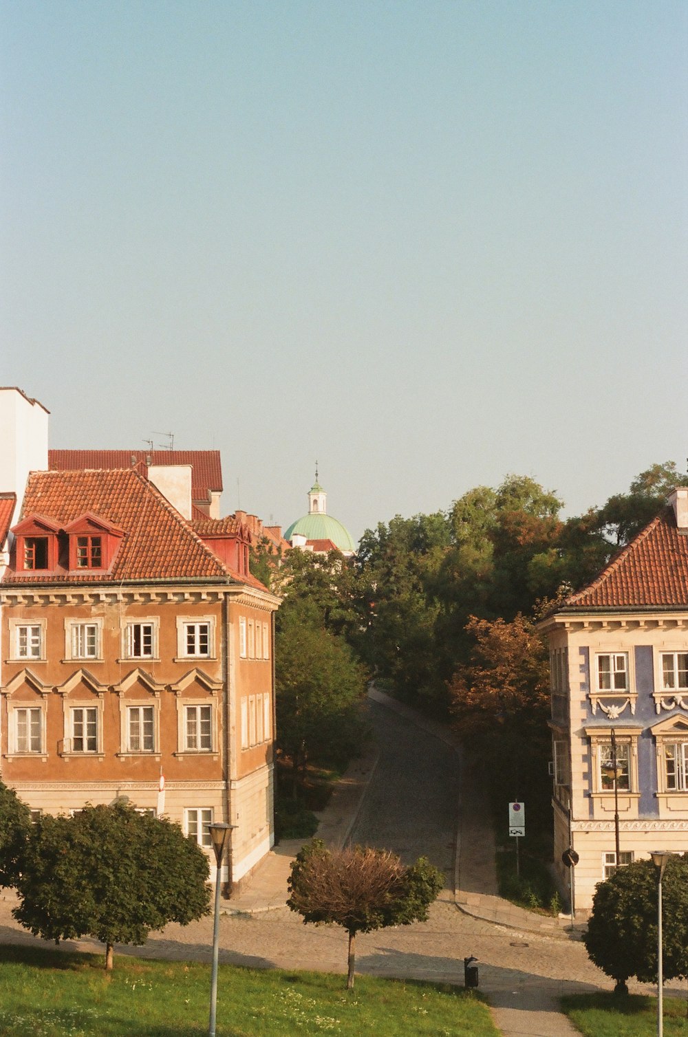 a view of a street with a building in the background