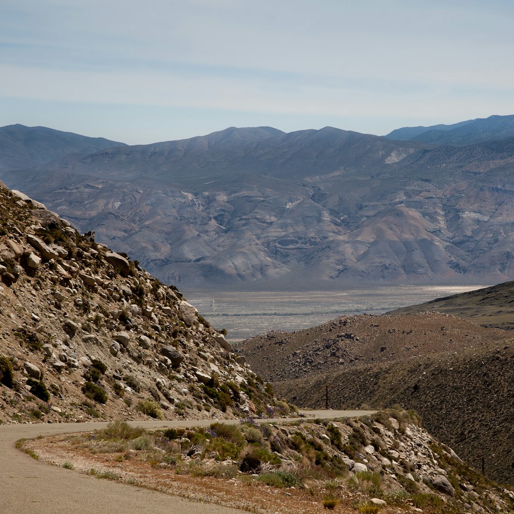 a view of a mountain range from a road