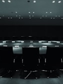 A shadowy committee meeting, representing the dark forces at play.