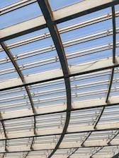 a close up of a metal structure with sky in the background