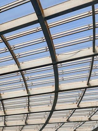 a close up of a metal structure with sky in the background