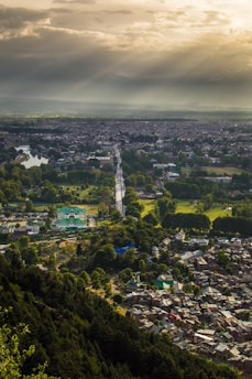 a view of a city from the top of a hill