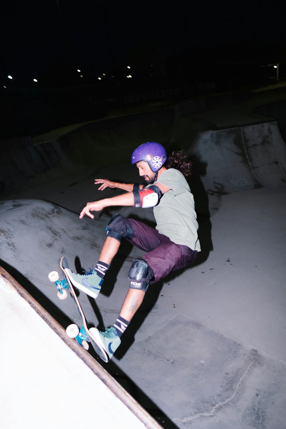 a man riding a skateboard up the side of a ramp