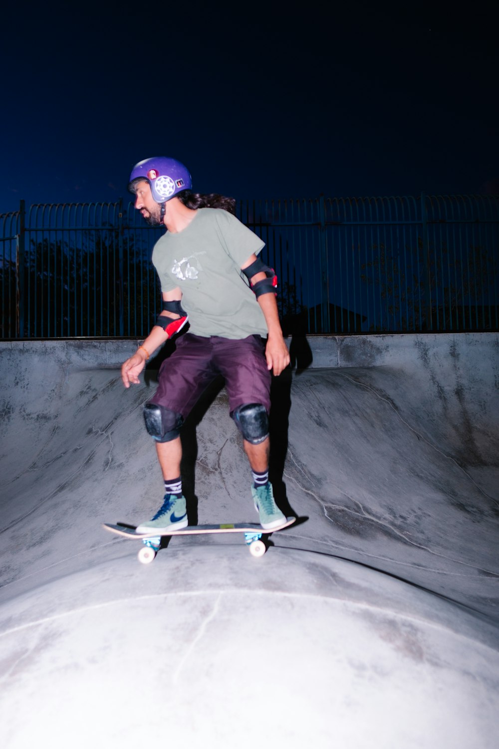 a man riding a skateboard up the side of a ramp