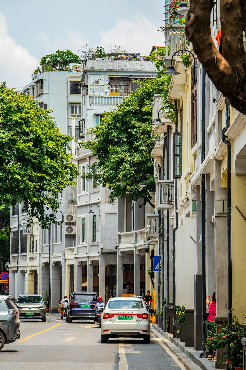 a city street filled with lots of tall buildings