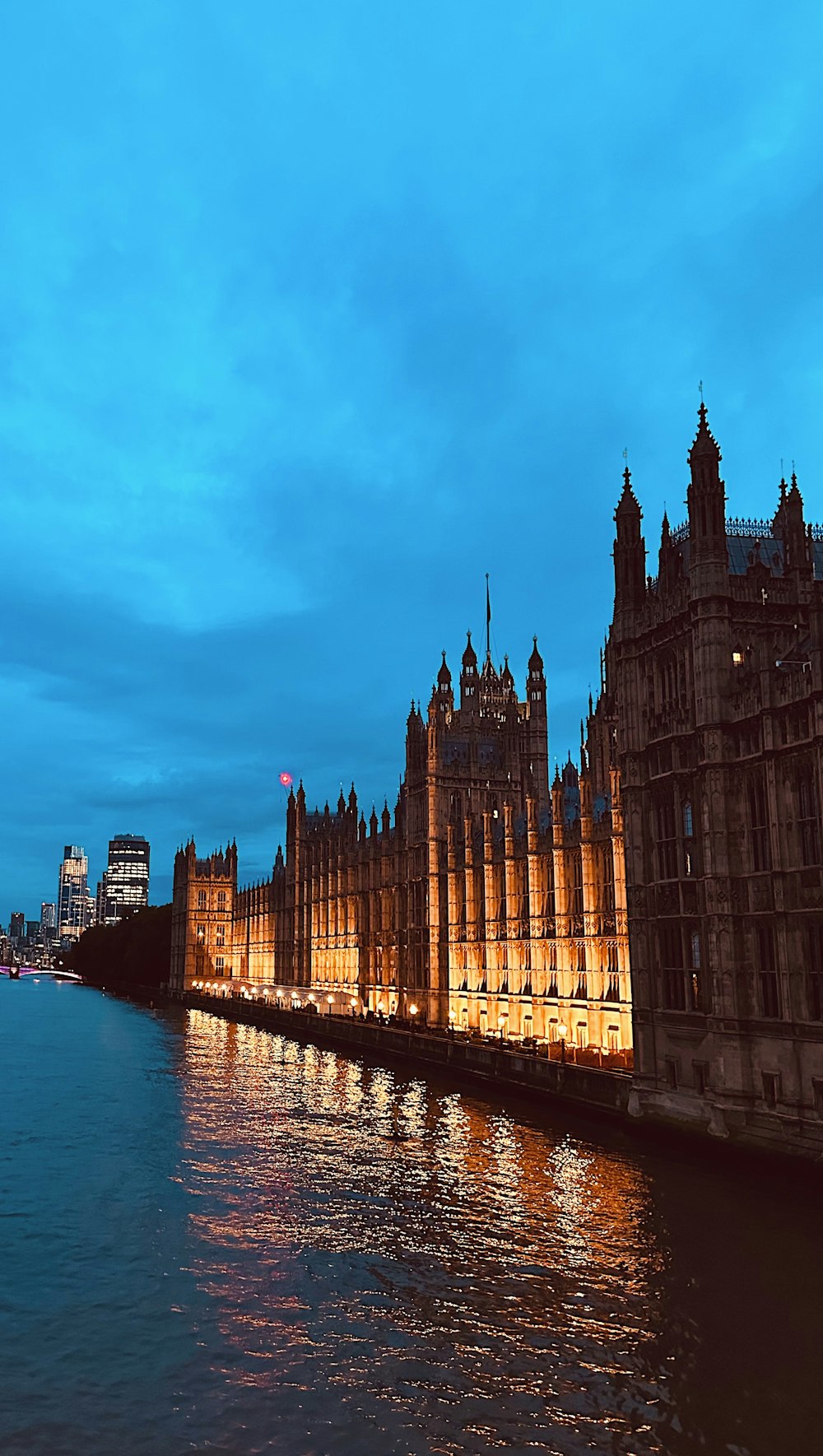 big ben and the houses of parliament lit up at night