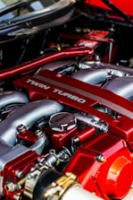 Close-up of a turbocharger installation on a high-performance engine.