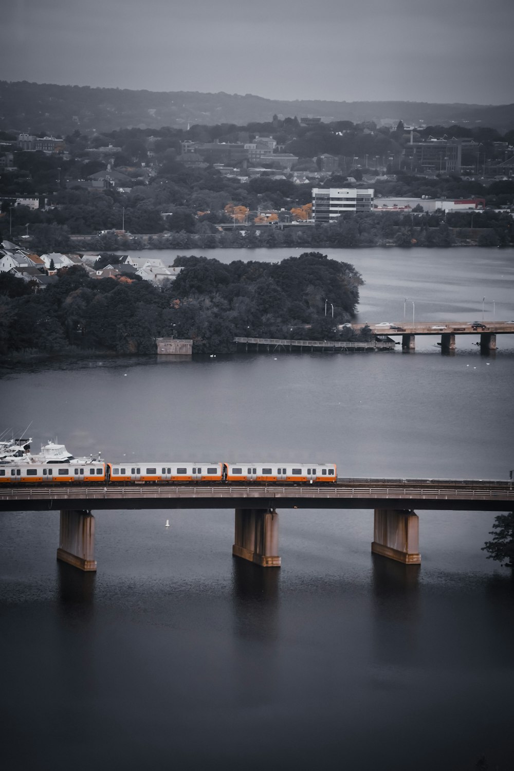 a train on a bridge over a body of water