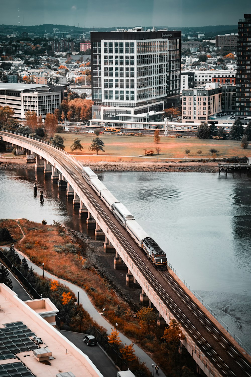 a train traveling over a bridge over a river