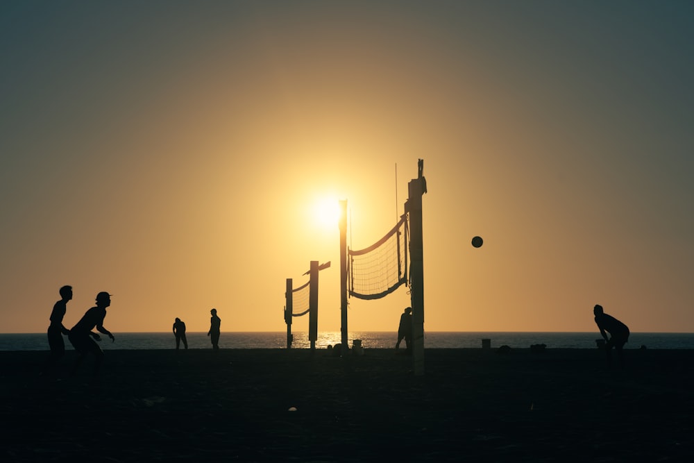 a group of people playing a game of volleyball