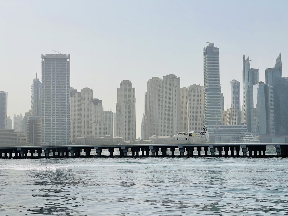 a large body of water with a city in the background