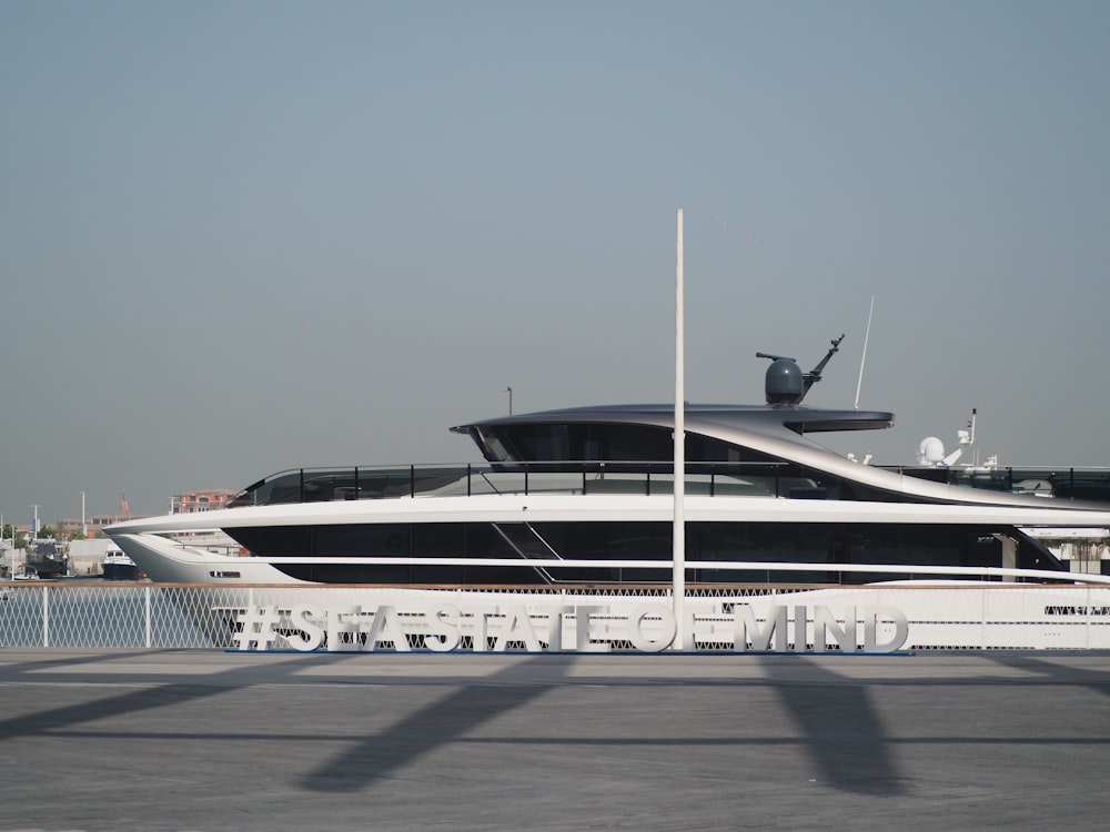 a large white boat sitting in a harbor