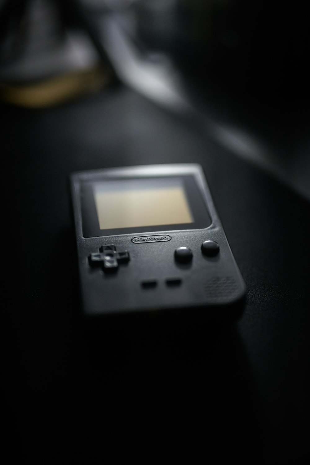 a close up of a gameboy on a table