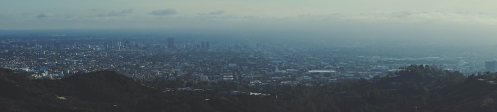 a view of a city from the top of a hill