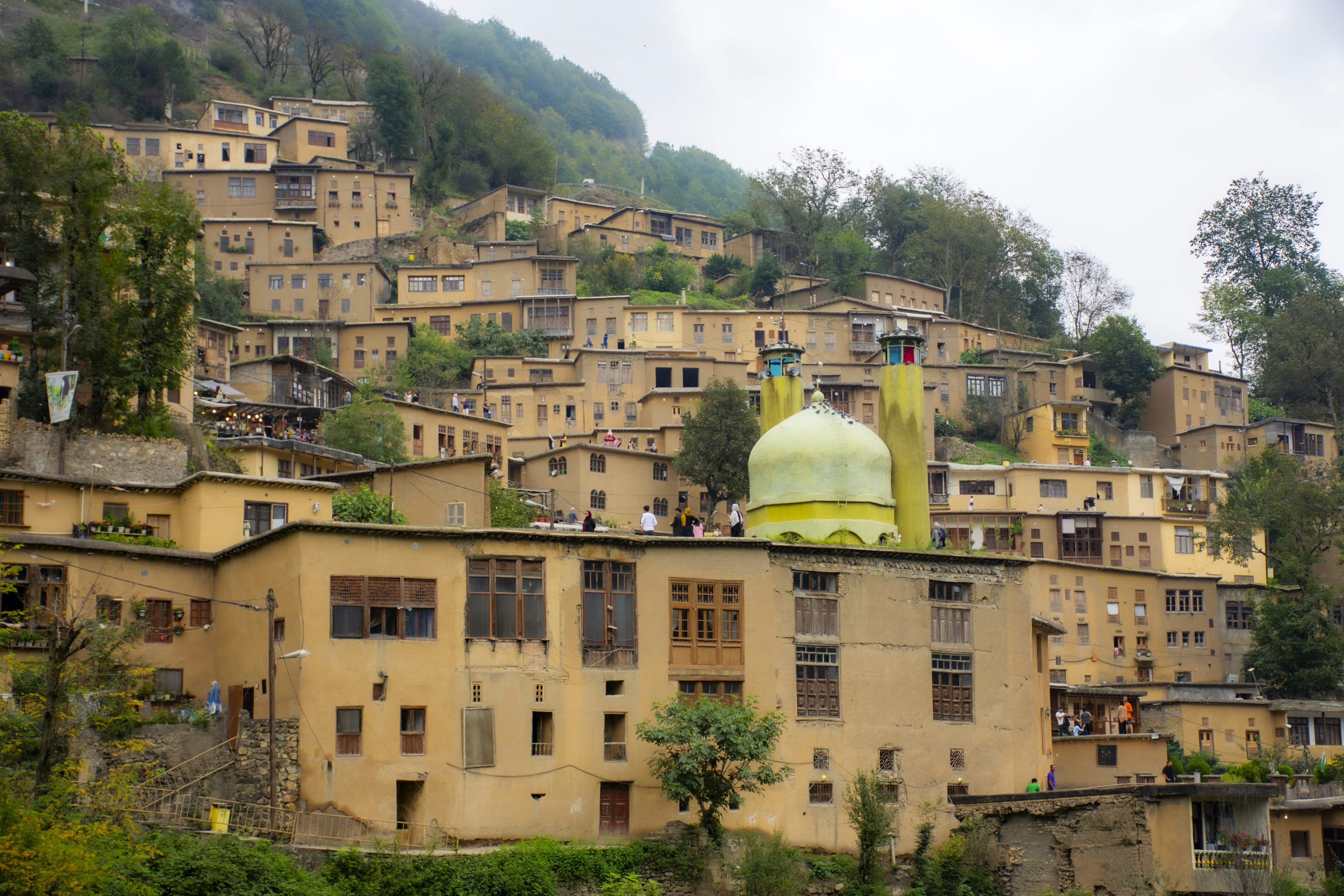 A large building with a yellow dome on top of it