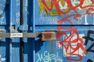 Industrial sticker on a rugged plastic container used in automotive manufacturing.