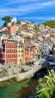 Vibrant street scene in a colorful coastal village along the Amalfi Coast.