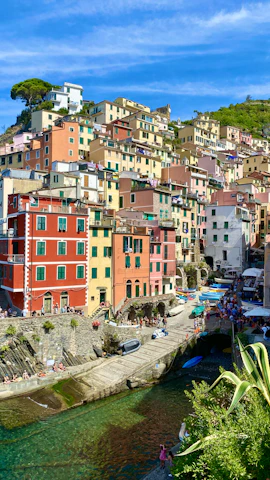 Vibrant street scene in a colorful coastal village along the Amalfi Coast.