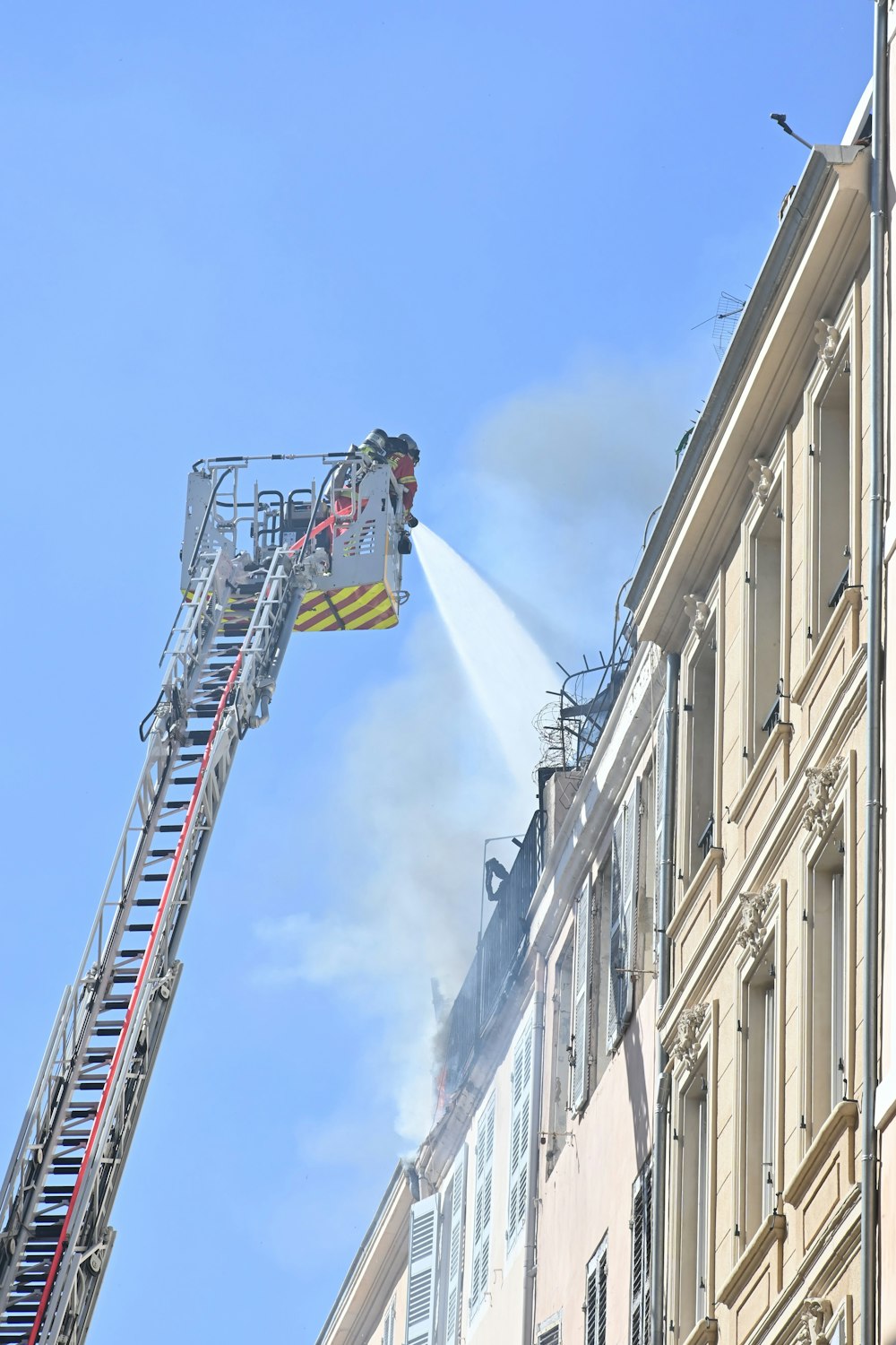 a fire truck spraying water on a building