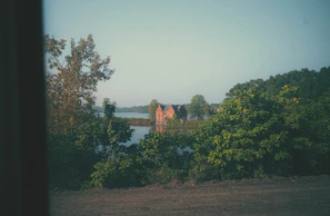 A serene view of a picturesque vacation rental house with a garden.