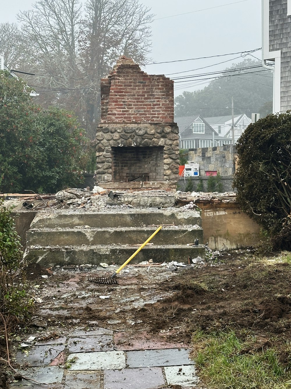 a fire place sitting in the middle of a yard