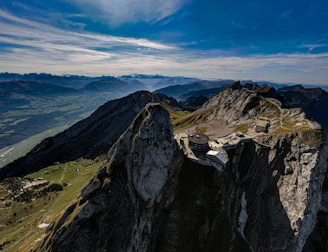 a view of a mountain range from the top of a mountain
