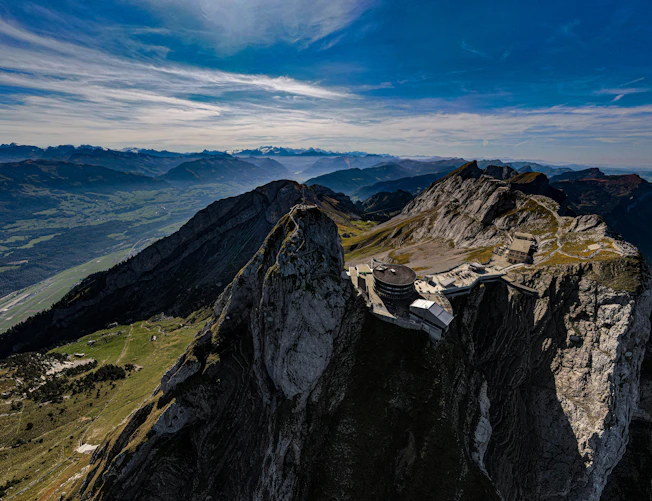 a view of a mountain range from the top of a mountain