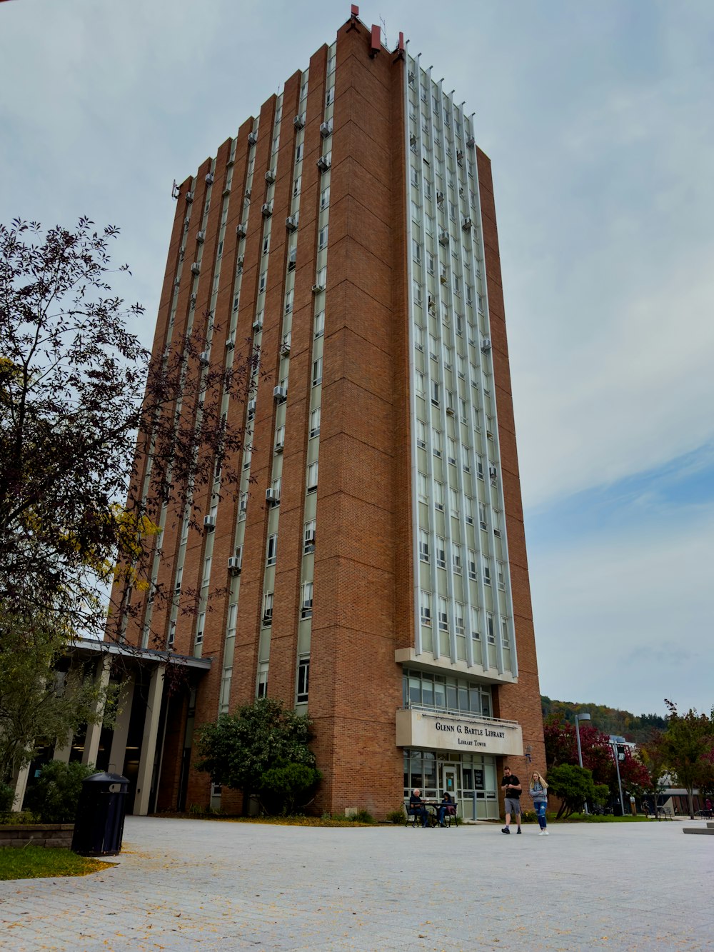 a tall brick building with a sky background