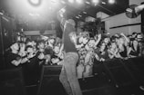 A vibrant concert scene with an enthusiastic audience.