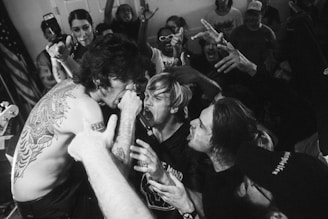 A dynamic music video scene featuring an artist performing passionately.