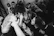 Close-up of échovif's lead singer deeply immersed in the music during a live show.