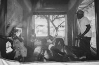 Parents watching attentively as trained monitors supervise kids playing on a safe inflatable bounce house.