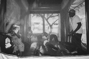 Parents watching happily as their children enjoy a safe and clean inflatable setup