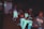 A group of diverse gamers enjoying playing video games together in a cozy room.