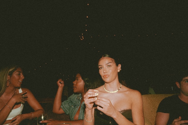 A warm, inviting lounge setting where people are engaged in calm, respectful conversation.