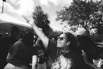 Volunteers engaging warmly with community members during an outreach event.