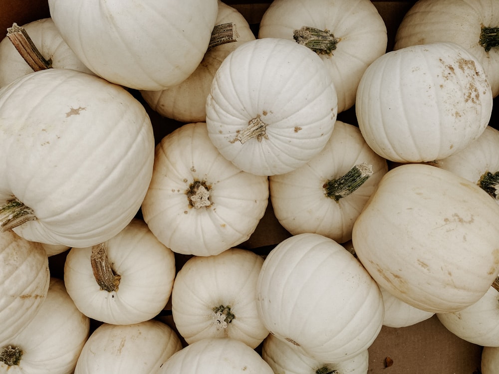 a bunch of white onions in a box