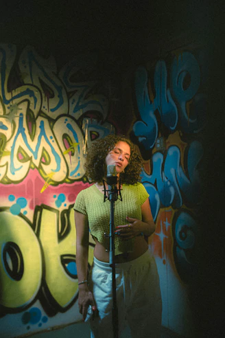 a woman standing in front of a microphone