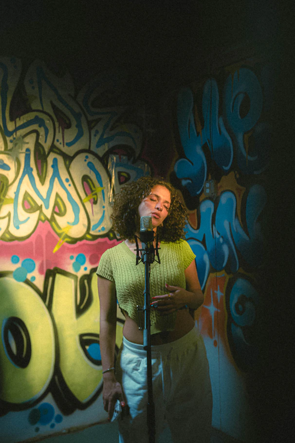 a woman standing in front of a microphone