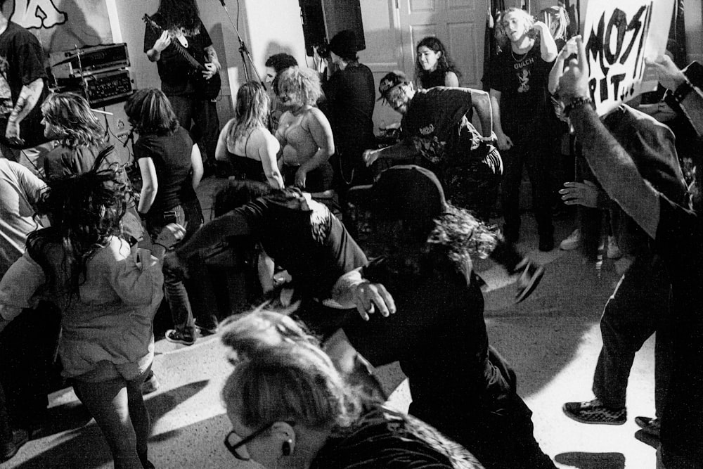 a group of people dancing in a room
