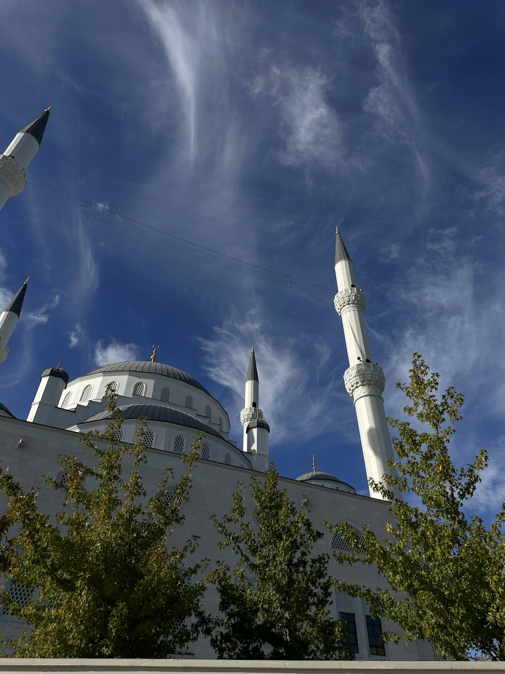 a large white building with a sky background