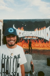 A smiling customer wearing a personalized t-shirt with a unique print.