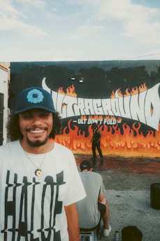 A smiling customer wearing a personalized t-shirt with a unique print.