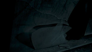 A conceptual photo with abstract shapes and shadows creating a mysterious atmosphere.