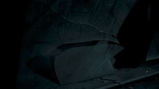 A conceptual photo with abstract shapes and shadows creating a mysterious atmosphere.