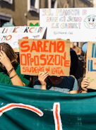 A passionate group of activists holding banners at an anti-mafia rally