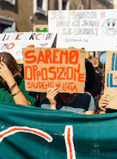 A vibrant community gathering in Livorno with banners showing support for Livorno Civica.