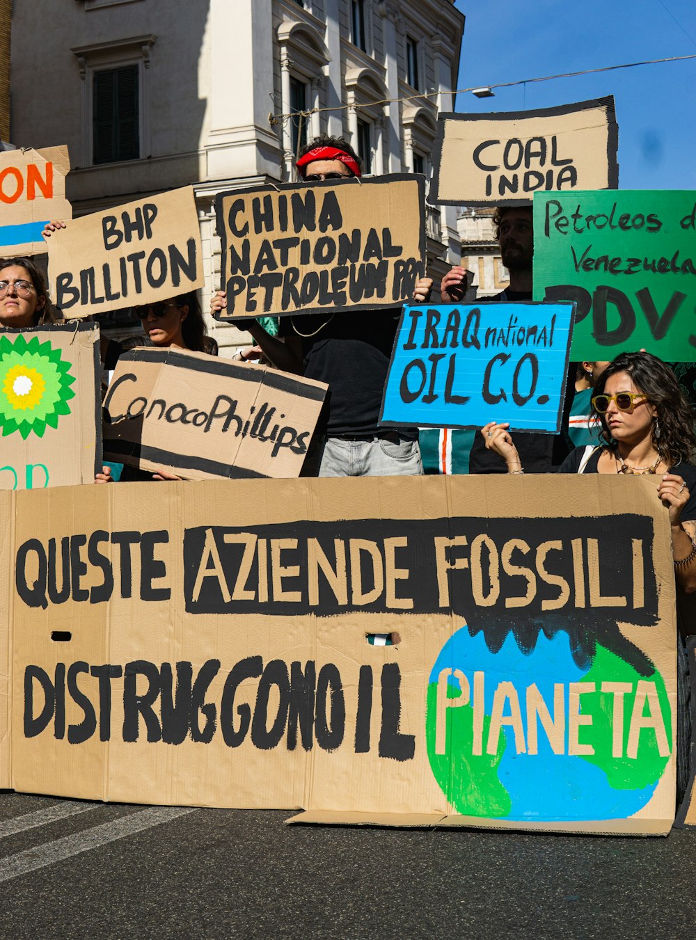 a group of people holding signs in the street